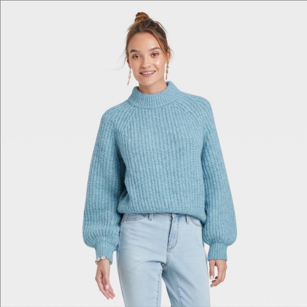 Women’s mock turtleneck sweater.